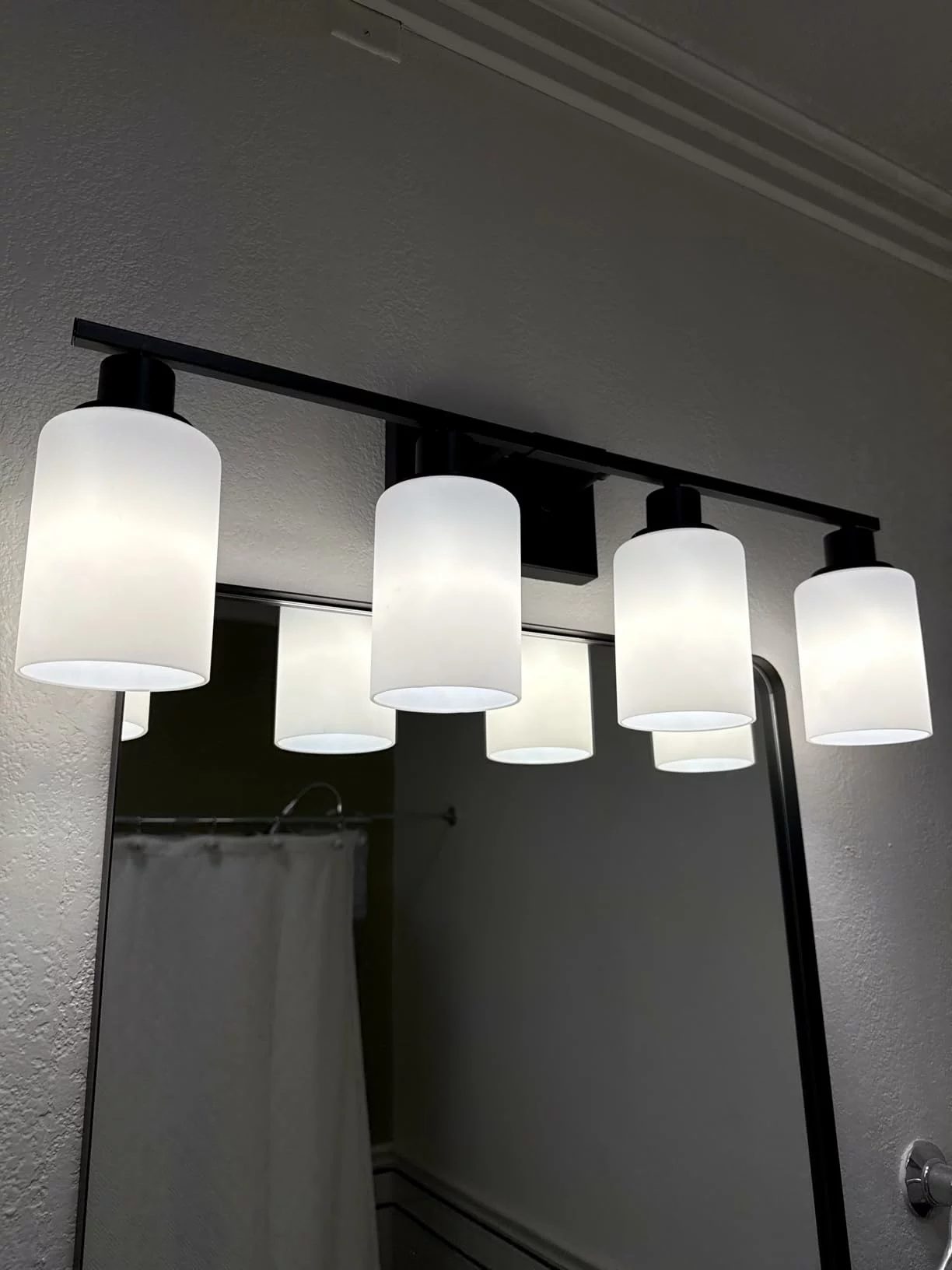 Click to view full screen MOKATNG 4-Light Bathroom Vanity Light Fixtures - Matte Black Wall Lamp with Milky White Glass Shades, Modern Bathroom Light Over Mirror for Living Room, Bedroom, and Cabinet photo review