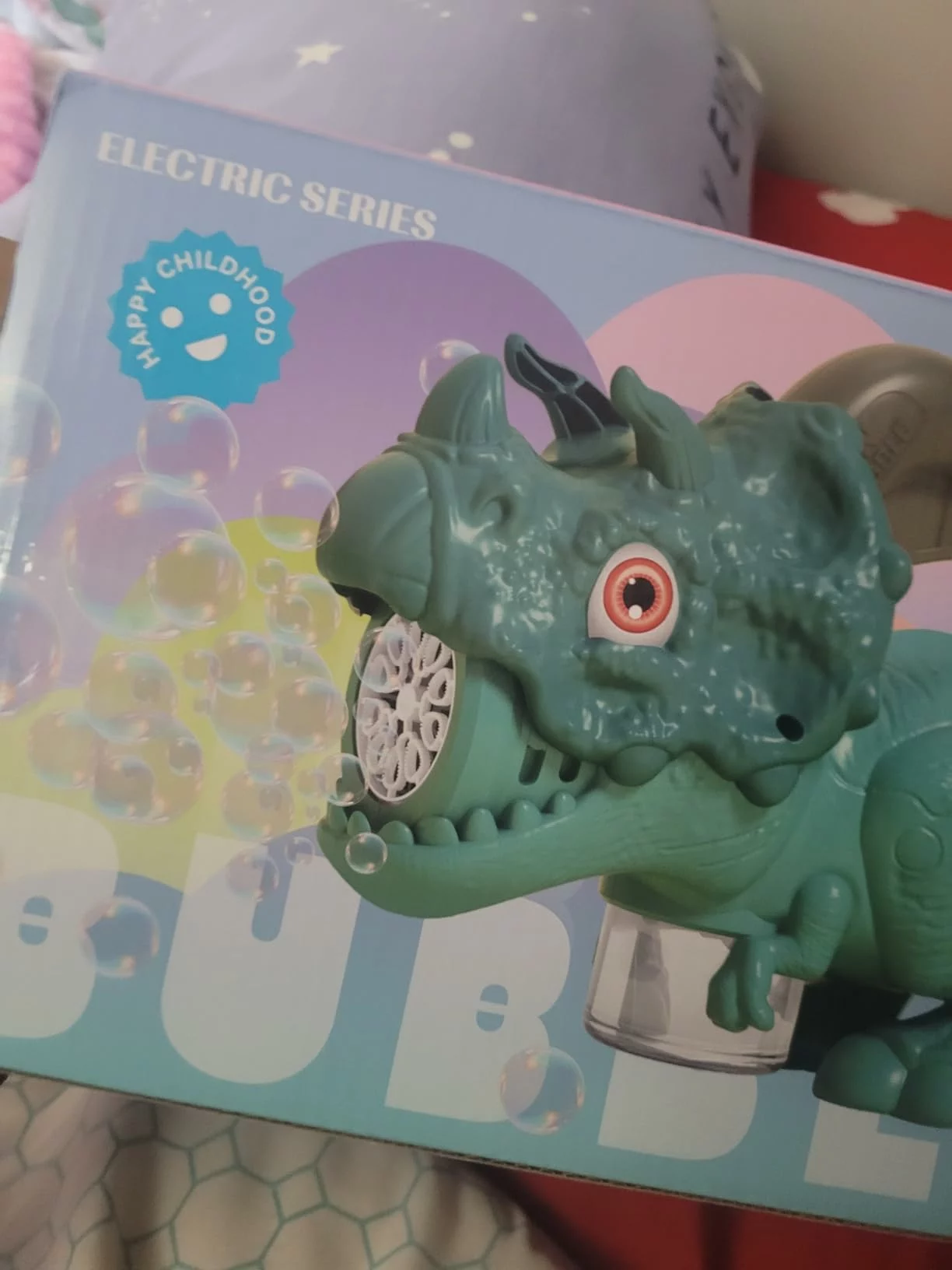 Click to view full screen Dinosaur Bubble Machine with Lights, Automatic Handheld Bubble Toy 20000+ Bubbles/Min for Kids Outdoor Party Yard Fun Gift photo review