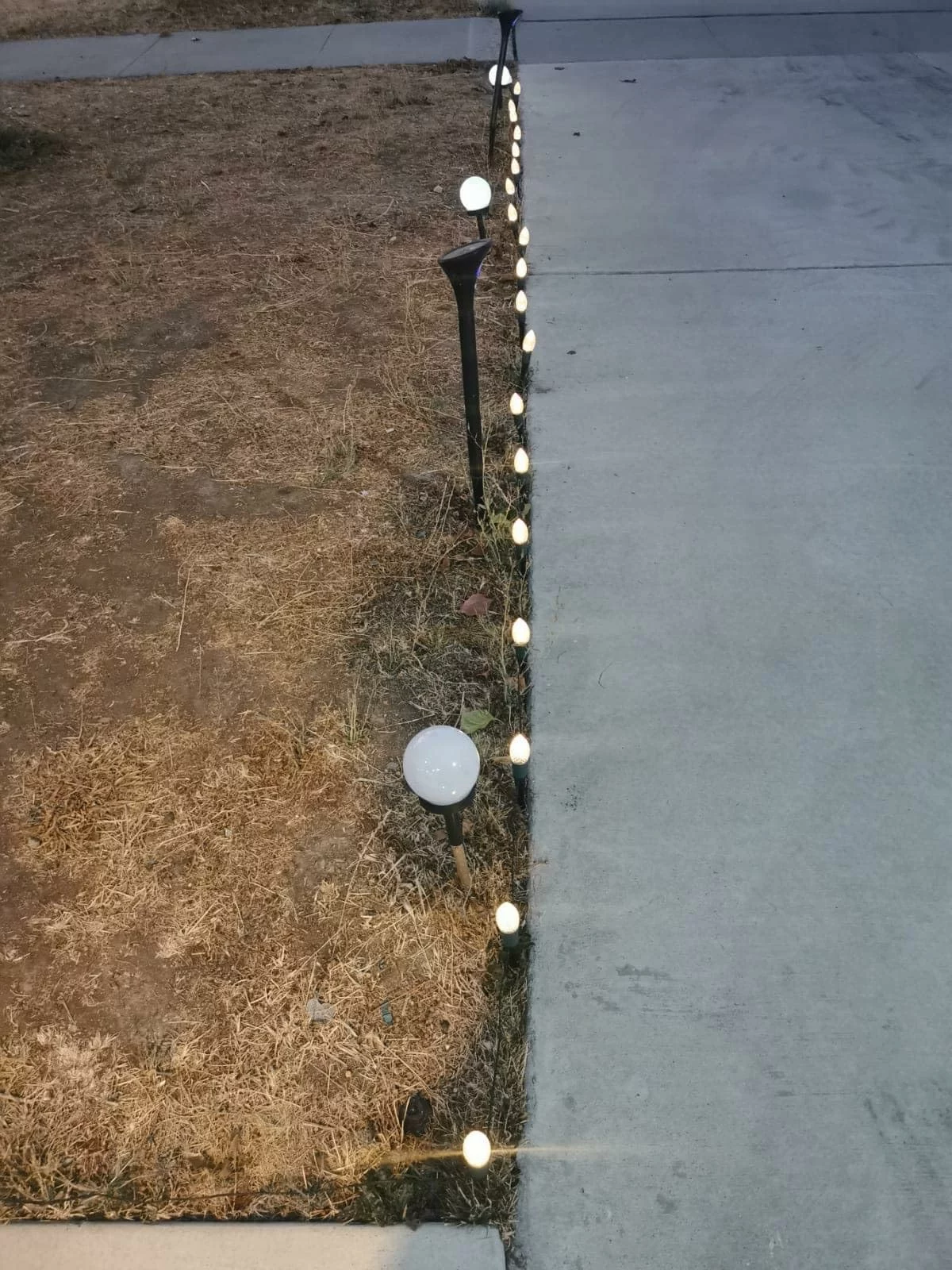 Click to view full screen 23Ft Solar Powered Christmas Pathway Lights, 20 LED C9 Multicolor String with 20 Stakes for Walkway & Patio photo review