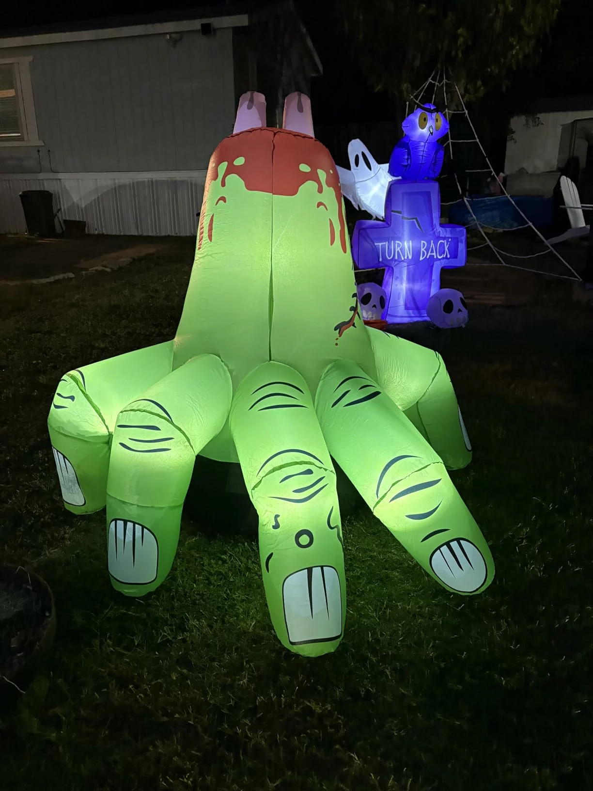 Click to view full screen GOOSH 6 FT Halloween Inflatables Hand Blow Up Yard Scary Green Giant with Built-in LEDs Garden Lawn Decor photo review