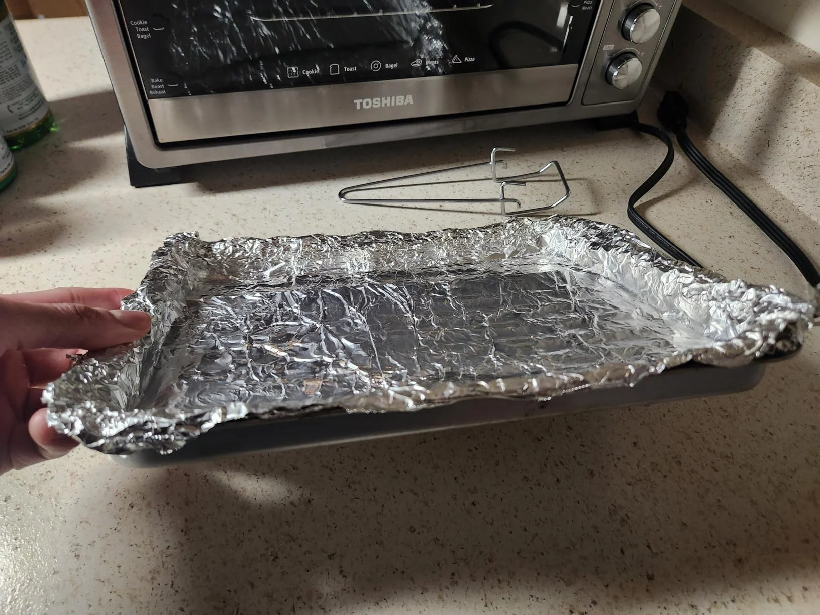 4-Slice Toaster Oven & Broiler with Stainless Steel Finish - Versatile Countertop Oven for Toast, Bagels, Baking, and Broiling - Space-Saving Design photo review